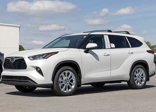 Image of a white Toyota 4Runner, parked outside.