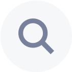 Icon of a magnifying glass.