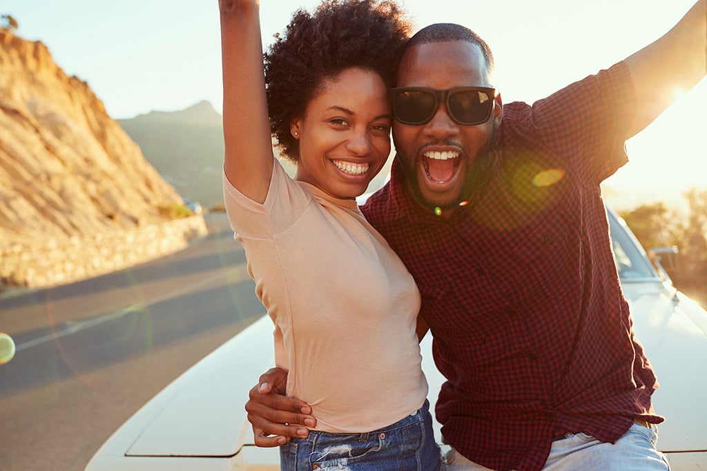 Young Couple Celebrating the sale of their Car