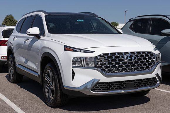 Image of a 2021 white Hyundai Santa Fe SUV