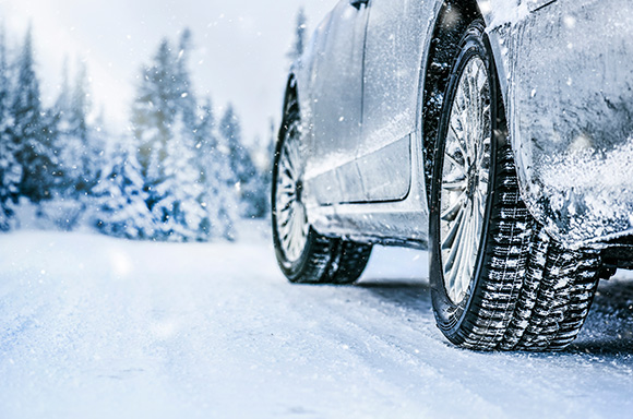 Image of a vehicle driving in the snow
